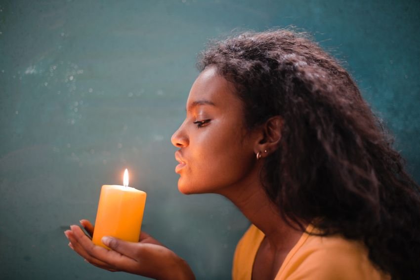 a woman with a candle