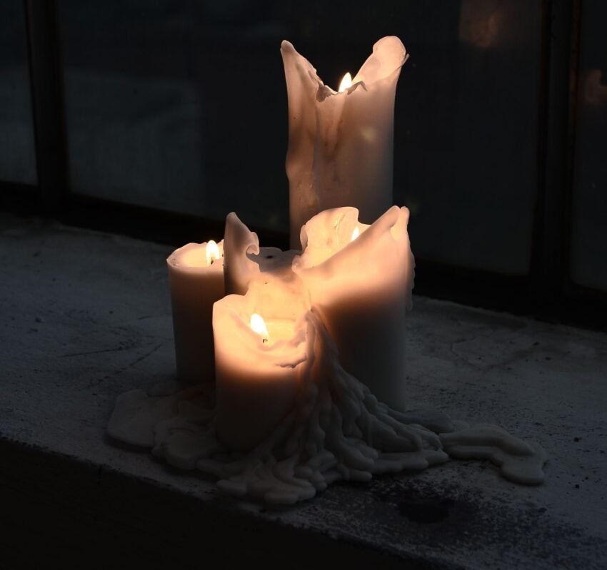 Candles melting with wax flowing down