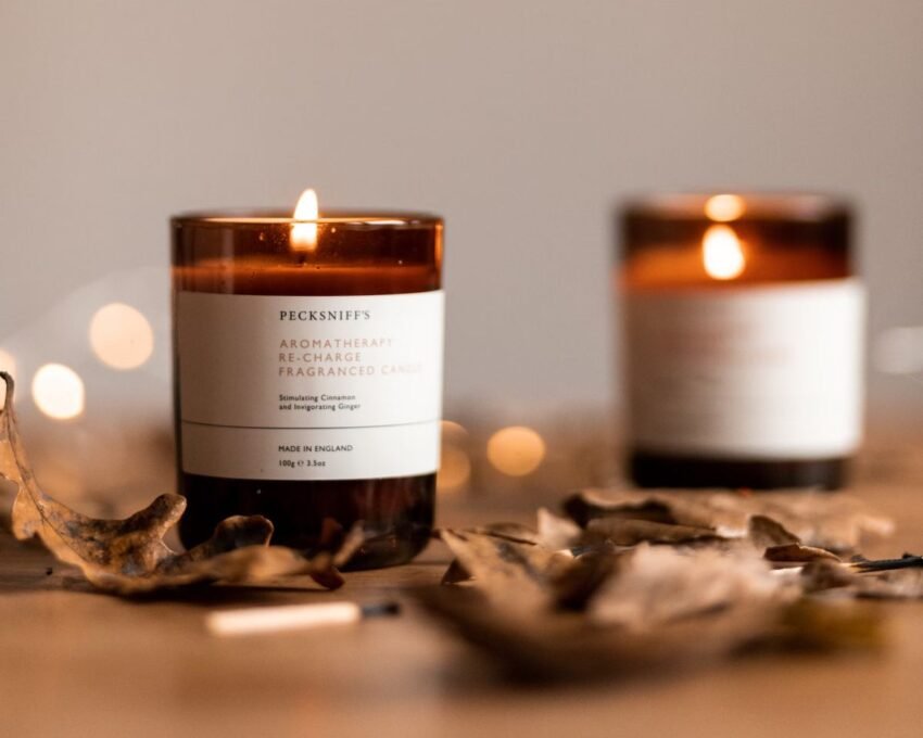 scented candles with dried leaves