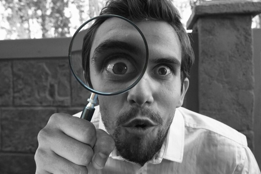 man with magnifying glass - detective finding proof