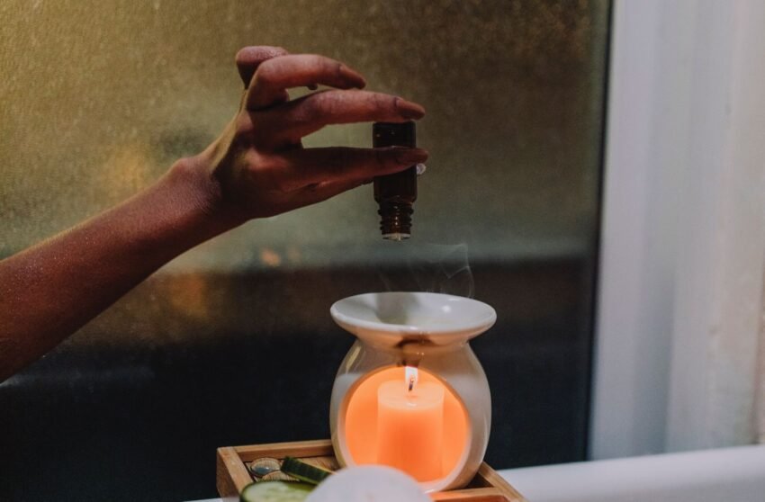 pouring essential oils into an oil burner